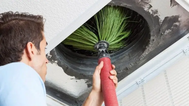 Technician Cleaning Air Ducts
