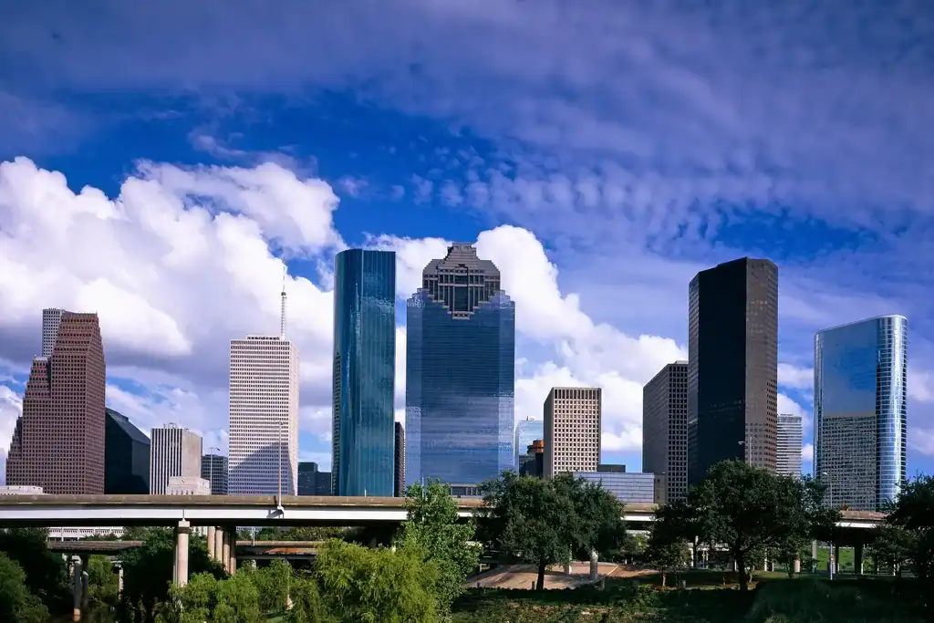 Coconut Cleaning Service Area - Houston, TX Downtown Houston skyline under a blue sky, Texas
